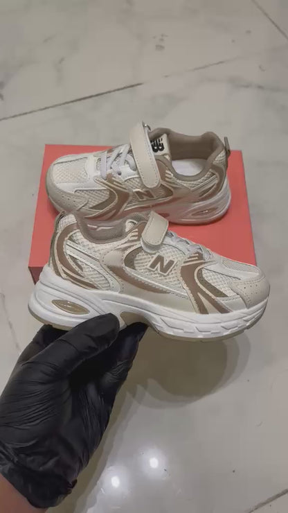 New Balance beige and white